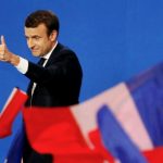 Emmanuel Macron, head of the political movement En Marche !, or Onwards !, and candidate for the 2017 French presidential election, gestures to supporters after the first round of 2017 French presidential election in Paris