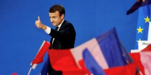 Emmanuel Macron, head of the political movement En Marche !, or Onwards !, and candidate for the 2017 French presidential election, gestures to supporters after the first round of 2017 French presidential election in Paris