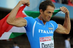 Italy's Fabrizio Donato celebrates after