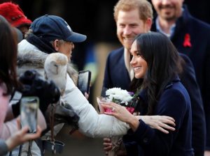 Britain's Prince Harry and his fiancee Meghan Markle greet well wishers as they arrive at an event in Nottingham