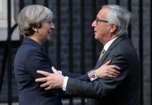 Theresa May greets Jean-Claude Juncker