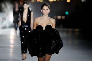 Model Kaia Gerber presents a creation by designer Anthony Vaccarello as part of his Spring/Summer 2018 women's ready-to-wear collection show  for fashion house Saint Laurent during Paris Fashion Week