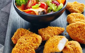 chicken nuggets and fresh vegetable salad