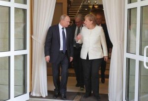 Vladimir Putin e Angela Merkel