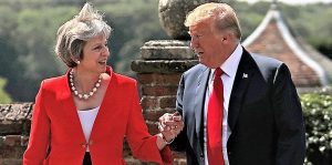 Britain's Prime Minister Theresa May and U.S. President Donald Trump walk to a joint news conference at Chequers, the official country residence of the Prime Minister, near Aylesbury