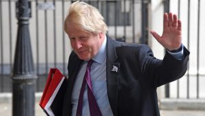 Britain's Foreign Secretary Boris Johnson waves as he leaves Downing Street in London